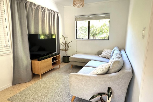 Comfortable lounge area with Apple TV and soundbar