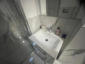 Bidet, towels, soap, shampoo