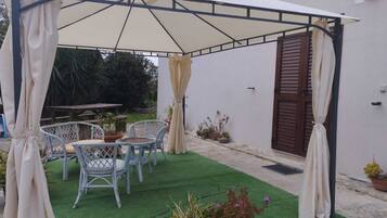 Comfort Triple Room, Garden View | Terrace/patio