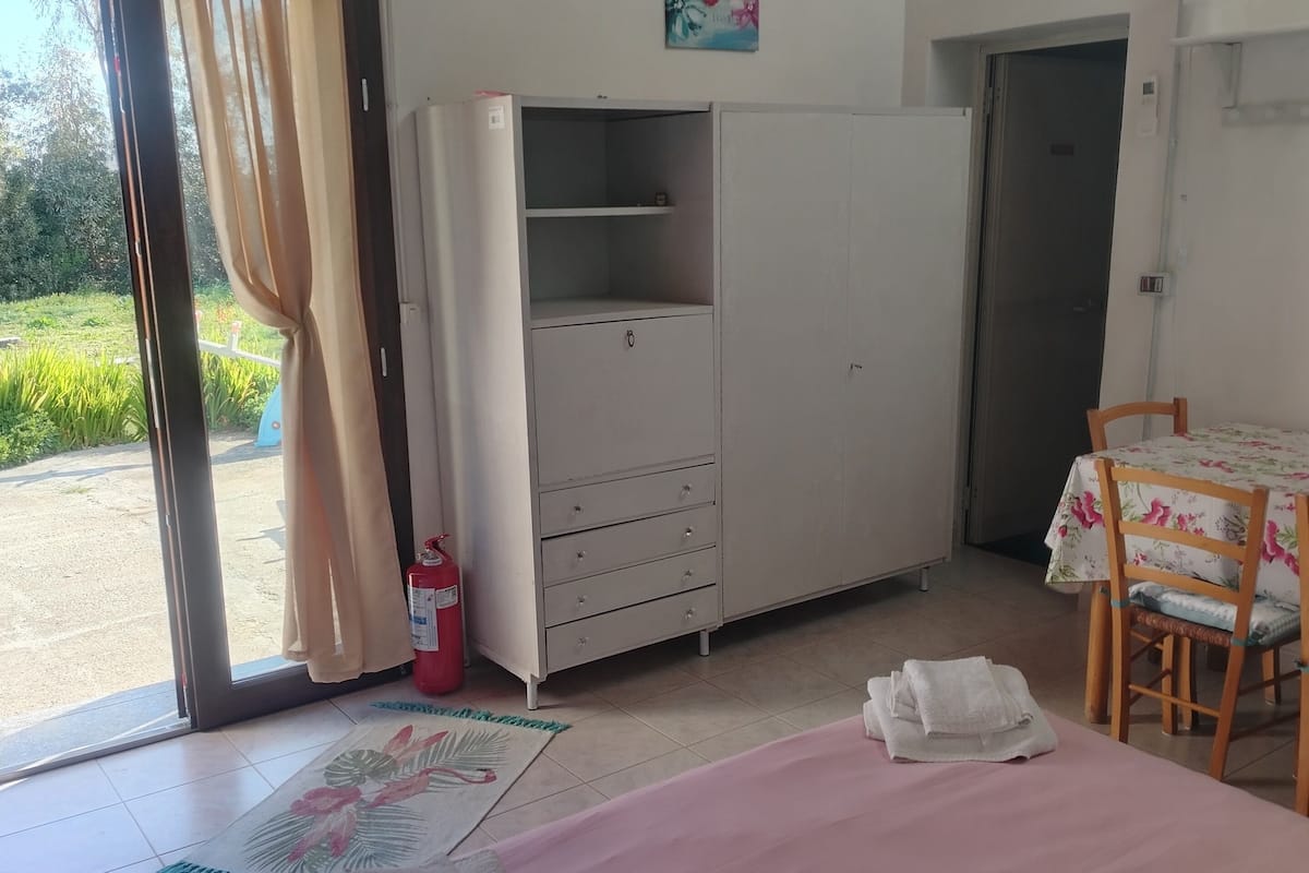 Comfort Triple Room, Garden View | 1 bedroom, blackout curtains, iron/ironing board