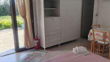 Comfort Triple Room, Garden View | 1 bedroom, blackout curtains, iron/ironing board