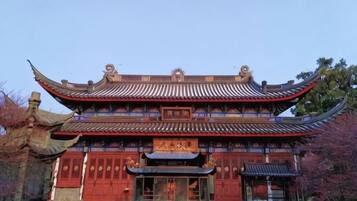 A traditional building with a multi-tiered roof and ornate decorations.