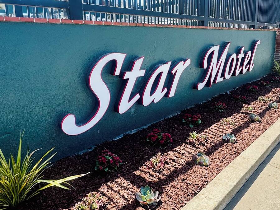 A motel sign with the name 'Star Motel' in large, bold letters.