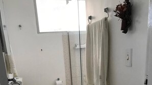 A bathroom with a sink, toilet, and glass shower enclosure. - Stunning view! Sea Front! (Mucuripe Fortaleza)