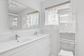 Shower, hair dryer, towels, soap