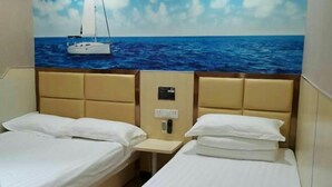 A hotel room with two beds, a headboard with a control panel, and a mural of a sailboat on the wall. - 100 Inn (Shanghai Jiangpu Road Metro Station) (Shanghai)