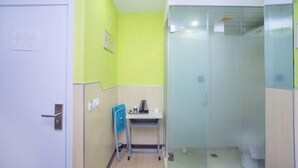 A small, brightly colored bathroom with a shower, a sink, and a toilet. - 100 Inn (Shanghai Jiangpu Road Metro Station) (Shanghai)