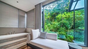 A modern bedroom with a large window, a built-in bench, and a bathtub. - Anji Meilin Resort (Anji)