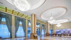 A spacious lobby with large windows, elegant chandeliers, and a play area for children. - Anji Meilin Resort (Anji)