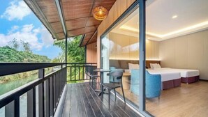 A modern room with a balcony, a bed, a sofa, and a table. - Anji Meilin Resort (Anji)
