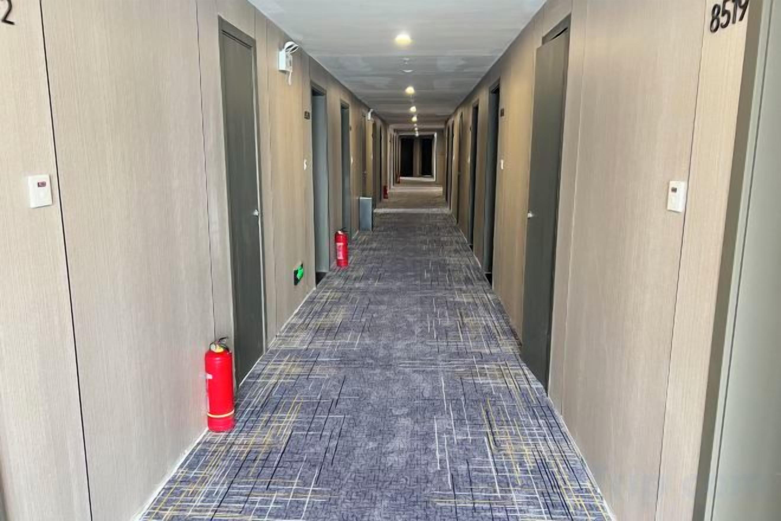 A hotel corridor with doors numbered 2 and 859.
