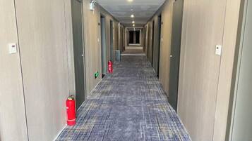 A hotel corridor with doors numbered 2 and 859.