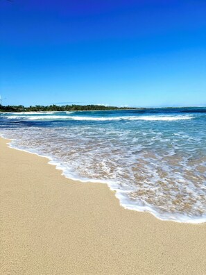 On the beach, sun loungers, beach towels