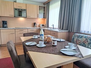 Enjoy a convenient kitchenette with microwave, coffee maker, and toaster, perfect for a quick breakfast.