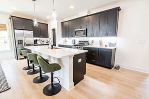 Fridge, microwave, oven, stovetop - “The Grande” 8 BR/8BA Downtown Apex, 2 Game Rooms! (Apex)