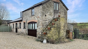 A stone building with a steep staircase, a wooden door, and a gravel driveway. - The Cider Barn, Waterrow, Nr Wivelsicombe (Waterrow)