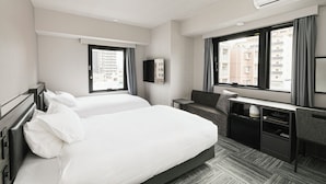 A hotel room with two beds, a desk, a chair, a flat-screen TV, and large windows with curtains. - HOTEL NOIR Kagoshima Chuo Station (Kagoshima)