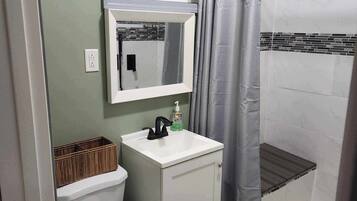 Shower, towels, soap, toilet paper