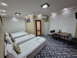 Vierpersoonskamer | Geluiddichte muren, een strijkplank/strijkijzer