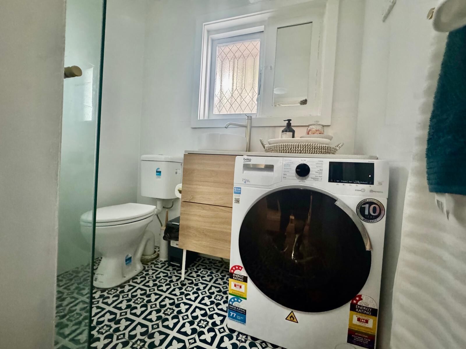 Shower, towels, soap, toilet paper