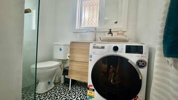 Shower, towels, soap, toilet paper