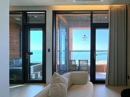 Terrace Spa Family Room | Living area | 75-inch Smart TV with cable channels, heated floors