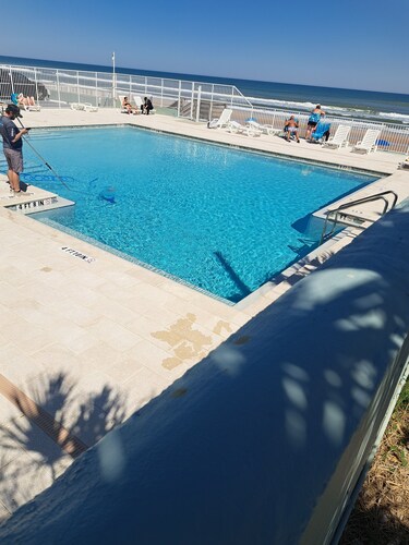 Come chill with us.  Enjoy this cozy condo with beach access and a pool.