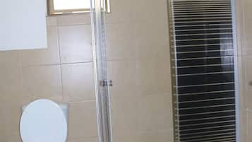 Studio | Bathroom | Shower, towels, soap, toilet paper