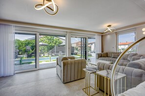 Family Villa, Multiple Bedrooms (Villa Samara with Pool) | Living room | 21-inch Smart TV with digital channels