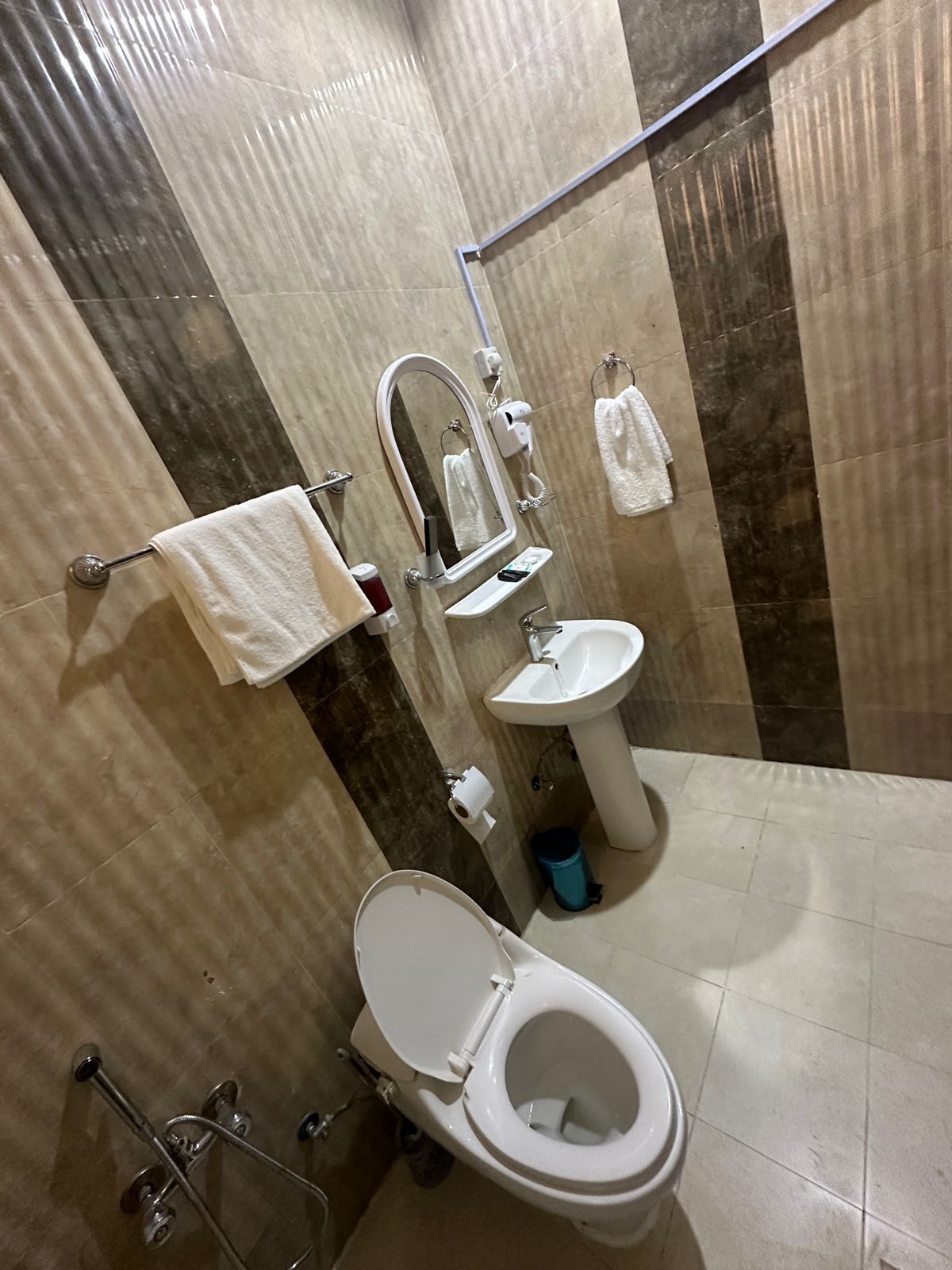 Shower, hair dryer, slippers, towels