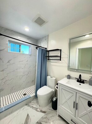 Shower, hair dryer, towels, soap