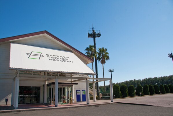 A building with a sign reading "SEARSPEAK ACADEMY". - Seagaia Forest Condominiums (Miyazaki)