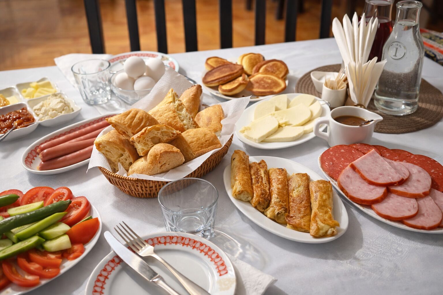 A breakfast buffet with various food items and condiments.