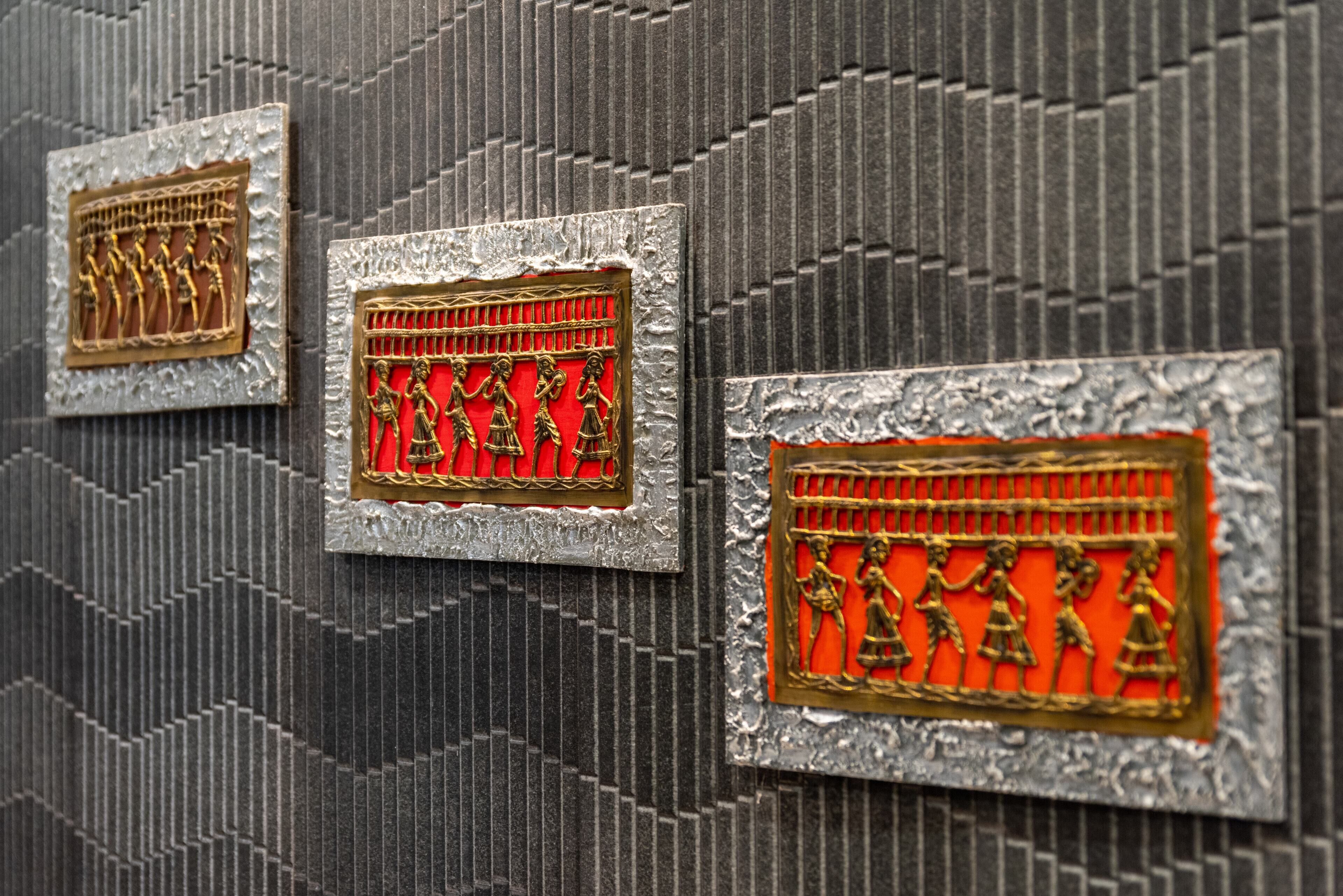 Three decorative panels with intricate designs.
