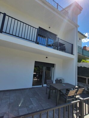 Enjoy a balcony with seating area and outdoor patio access.