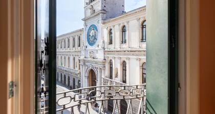 In the heart of Padua, an elegant place waits for you, embracing the historic Piazza dei Signori with a view that enchants the senses. This apartment, is located on the third floor (no lift), a place where time seems to stand still and the beauty of the