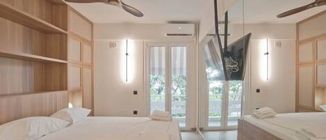 Tabla de planchar con plancha, wifi y ropa de cama