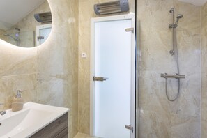 Shower, hair dryer, towels, soap