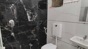 Shower, slippers, soap, shampoo