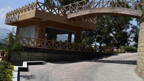 A reception area with a wooden archway and a sign labeled "RECEPTION".