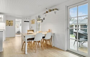 Enjoy meals in the spacious dining area with a view of the outdoors.