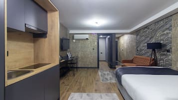 Deluxe Suite, 2 Bedrooms | Private kitchen | Mini-fridge, stovetop, electric kettle, cookware/dishes/utensils