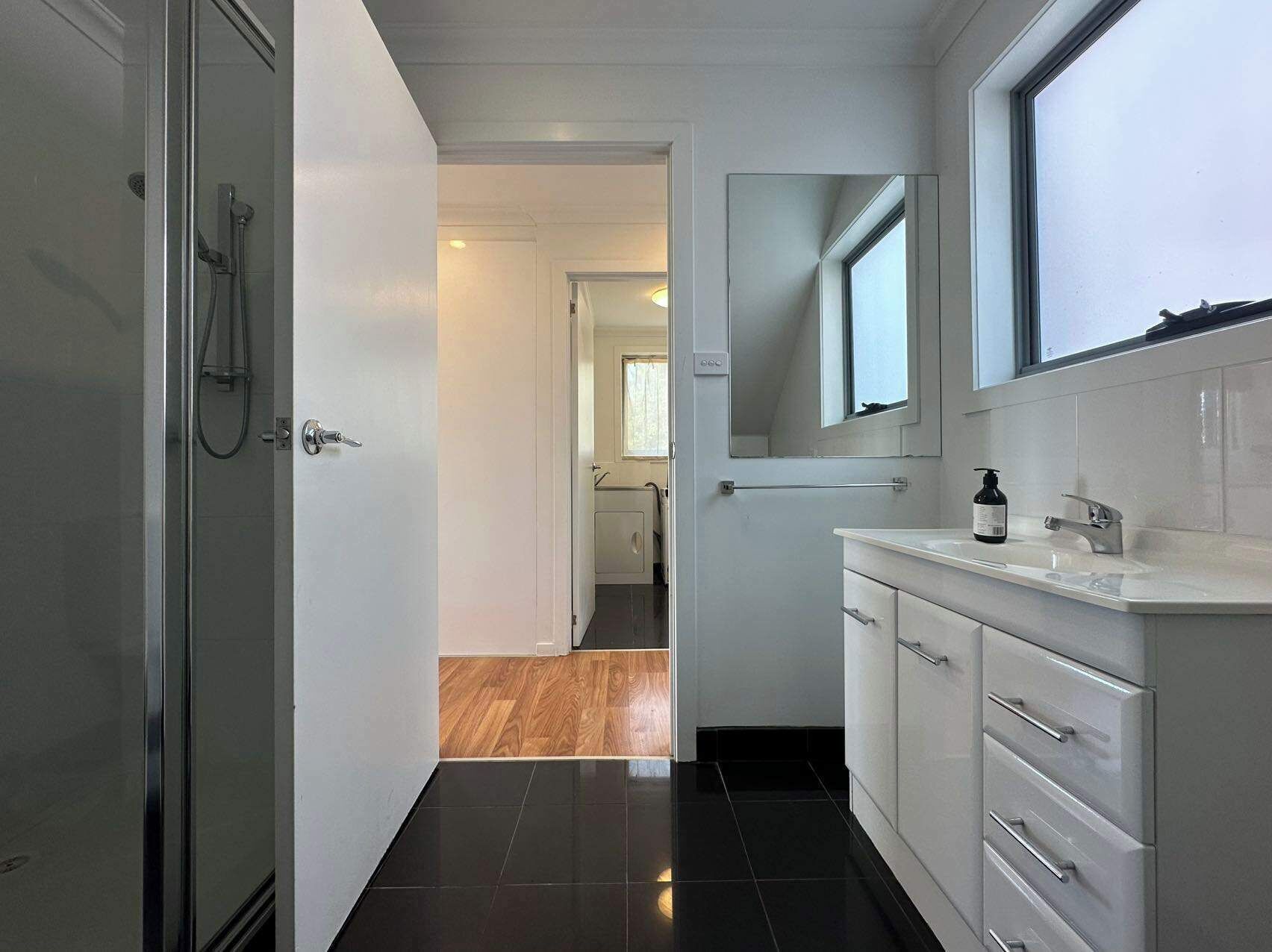 Shower, hair dryer, towels, shampoo
