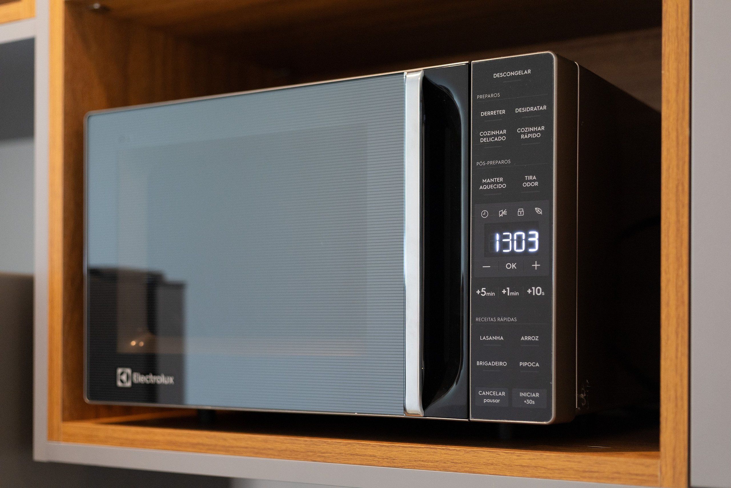A microwave oven with a digital display and various settings.