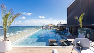 Outdoor pool, pool umbrellas, pool loungers