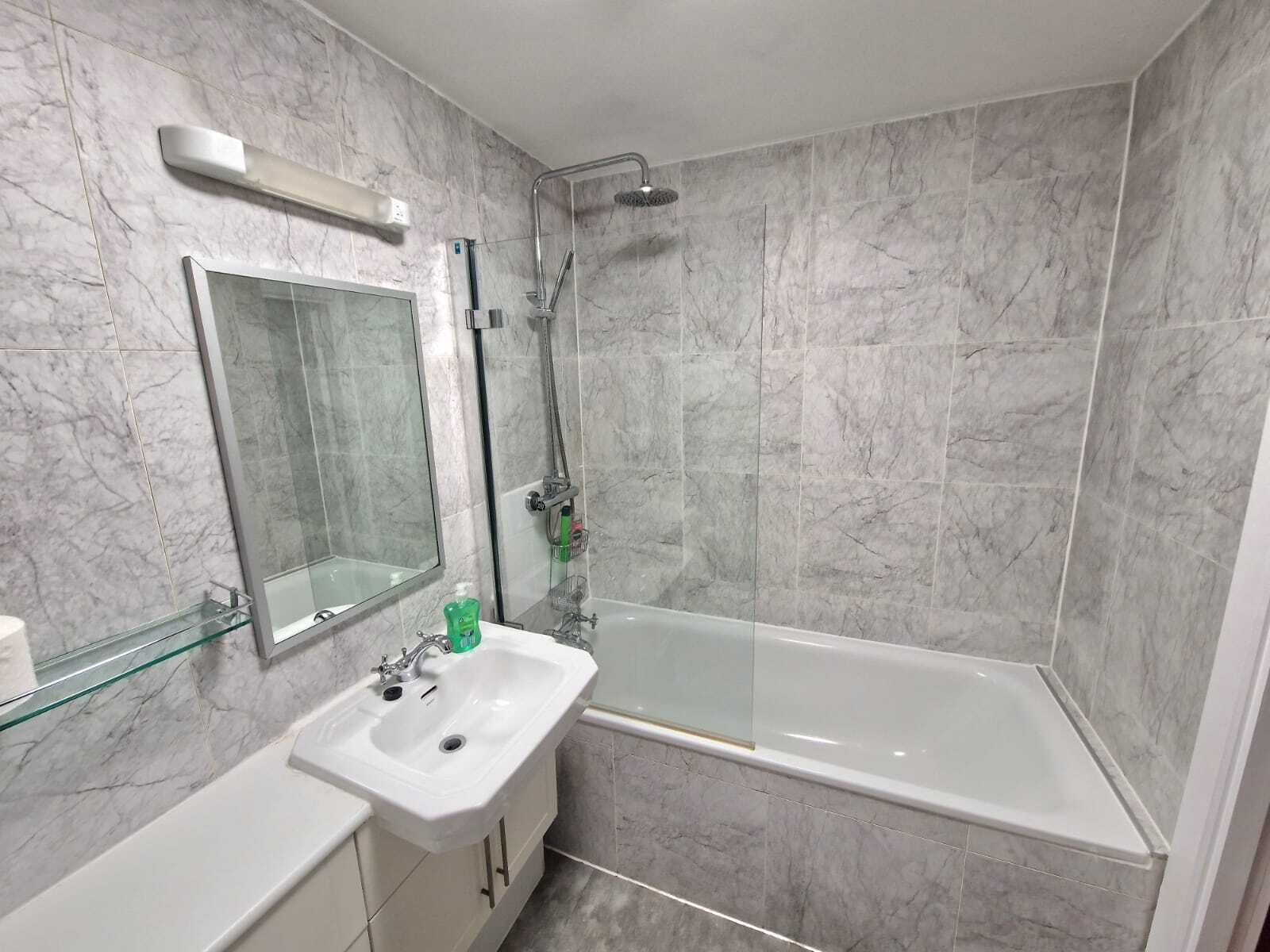 Shower, hair dryer, towels, shampoo