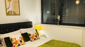 1 bedroom, desk, iron/ironing board, travel cot