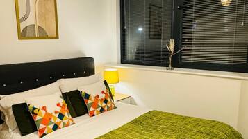 1 bedroom, desk, iron/ironing board, travel cot