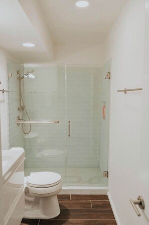 Shower, hair dryer, towels, shampoo