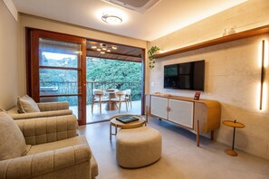 Luxury Apartment | Living area | Flat-screen TV